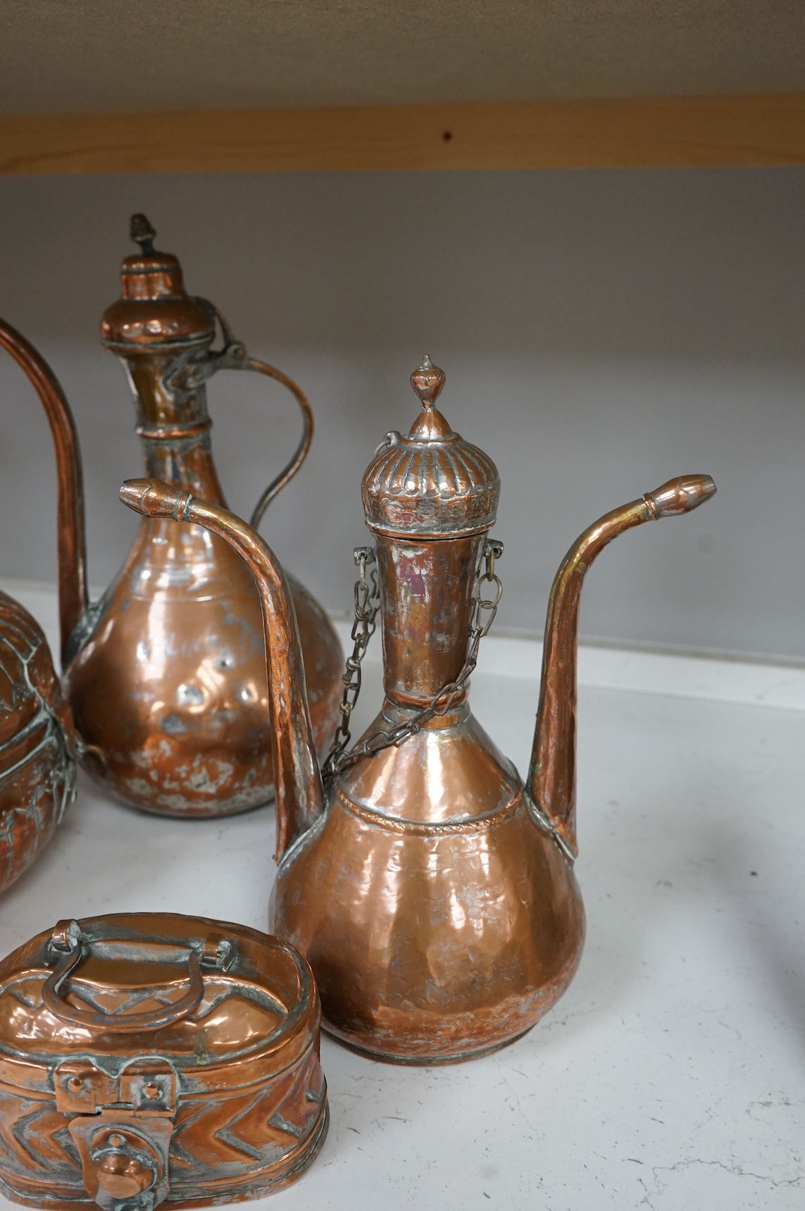 A collection of six various Arab copper vessels to include coffee pots, tallest 37cm